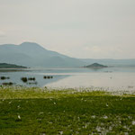 ....the lake is surrounded by high mountains....